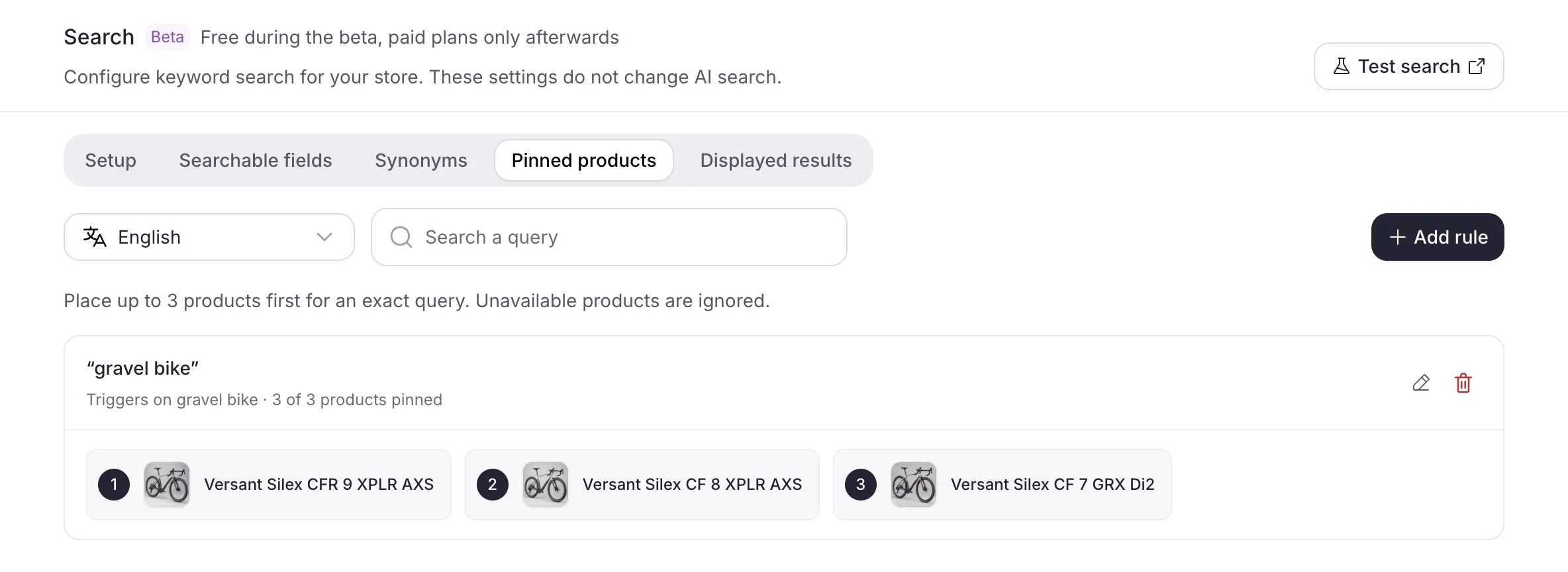The Pinned products tab: the language selector, the Add rule button and a pin rule with its query and its pinned products